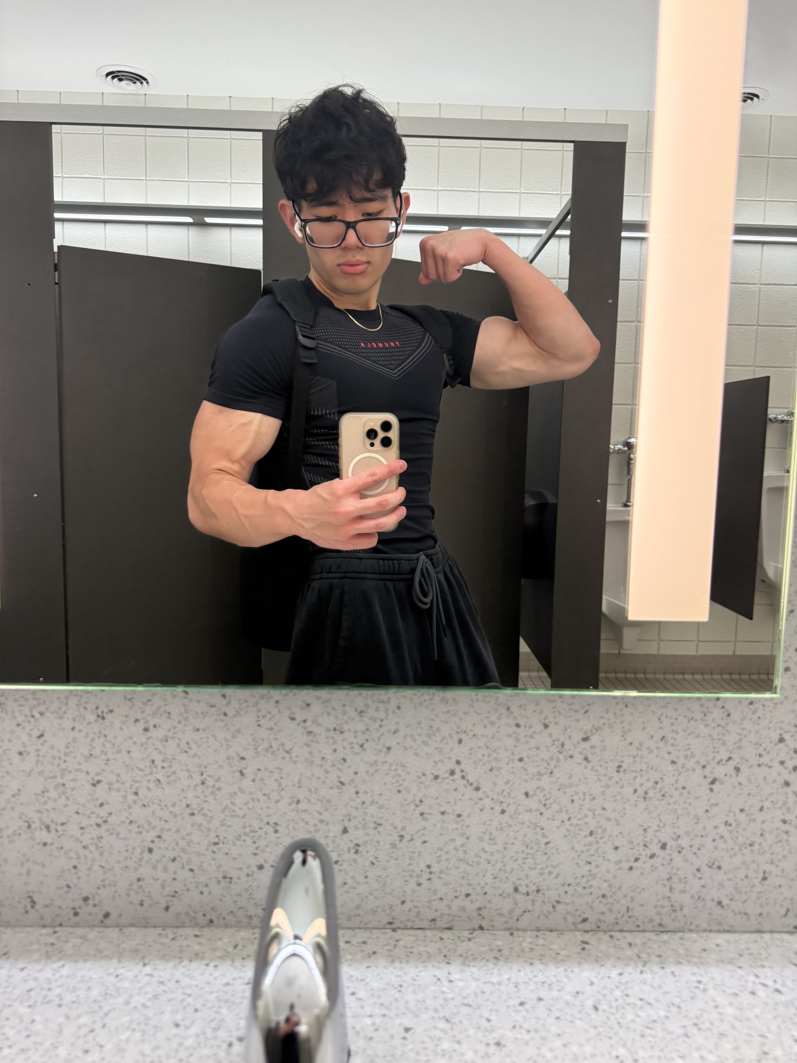 Gym mirror selfie mid-flex